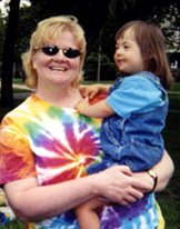 Quincy with her preschool teacher, Debbie Mytich, at an end-of-year 2001 party