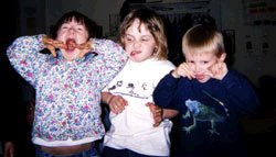 Quincy being silly with preschool friends, Charlie (center) and Brian in 2003
