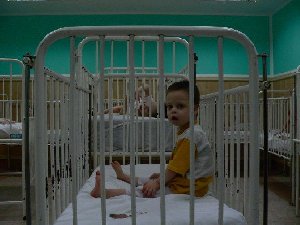 Rows and rows of neglected children alone in cribs at Kulina. Photo Marc Schneider 2007.