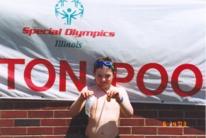 Joe Kane at ISU State Special Olympics: Gold Medal and Fourth Place Ribbon